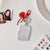 Transparent acrylic love bow keychain pendant can be placed, ID photo, big head sticker, photo frame, star chasing pendant, female.
